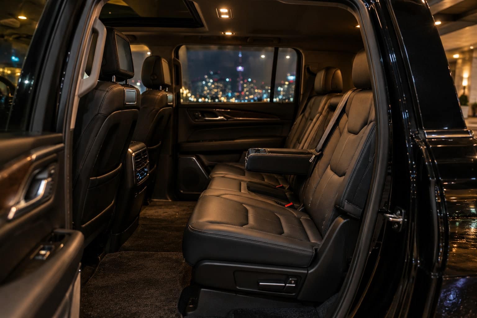 Rear seat of the extended SUV, seen from the open door.
